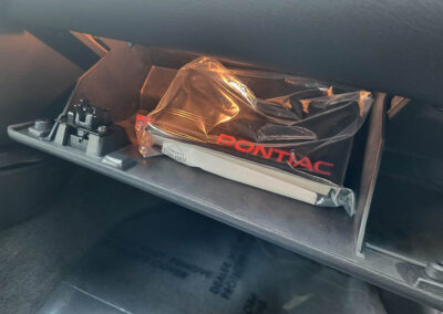 2001 Pontiac Trans Am in Black - interior glove box